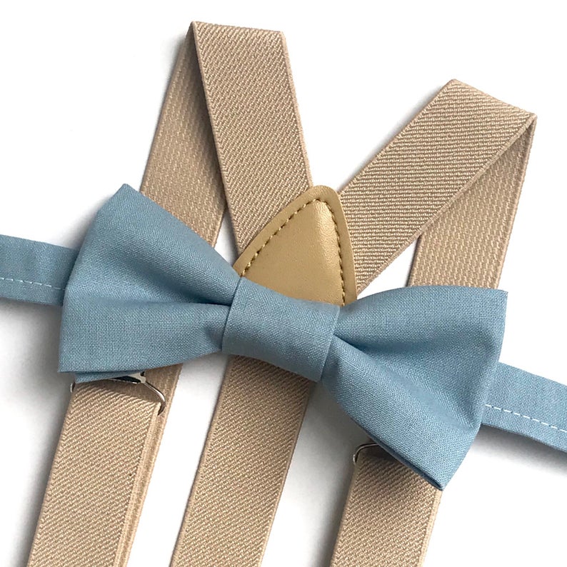 dusty blue bow tie and beige suspenders
